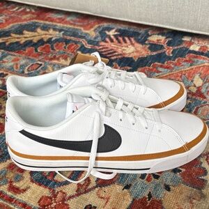 Nike White and Black Athletic Shoes with Gold Accents